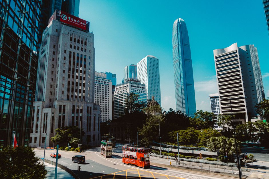 A vibrant view of Hong Kong's Central District showcasing iconic skyscrapers and city life.